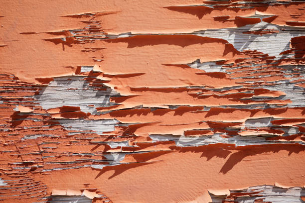 Wooden wall with red peeling paint, grunge background