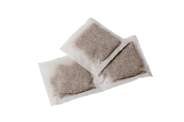 istock Herbs tea bags isolated on white background 1299472752