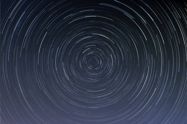 Star trails in a night sky Star trails in a night sky, long exposure style realistic circular star arcs pattern, star motion due to Earth's rotation vector illustration Long Time Exposure stock illustrations