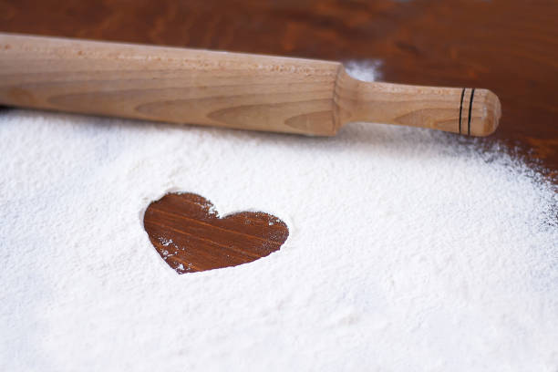 istock image of a heart on wheat flour and rolling pin 1299473038