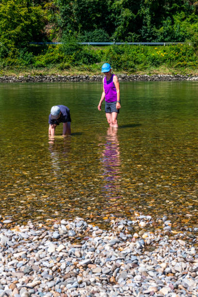 istock mother and son refreshing in Danube River 1299477824
