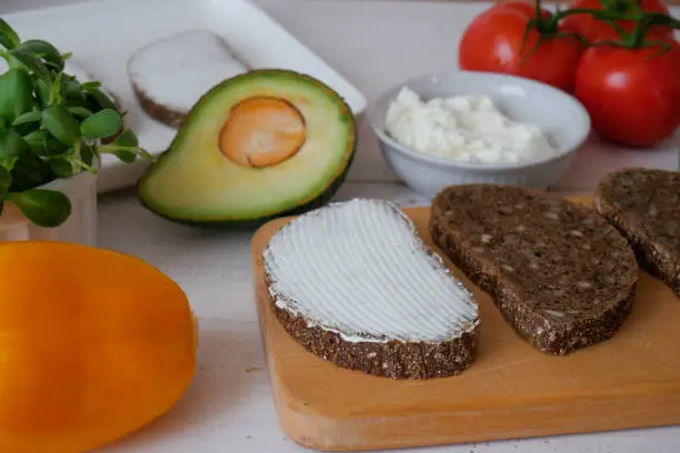 Photo of Sandwich on a tray. Sandwich. A sandwich. Morning sandwich with cream cheese and vegetables. Copyspace