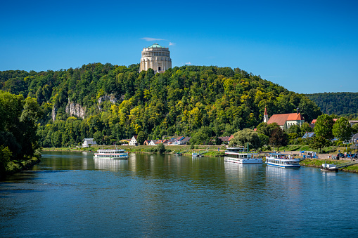 Tourboat with tourists on Danube River near Regensburg in bavaria.