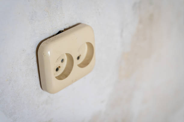 istock Electricity Outlet in Room remodeling Process with White Grunge Wall for Copy Space - Out of Focus, Abstract 1299486333