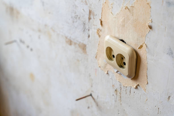 istock Power Outlet in Room remodeling Process with White Grunge Wall for Copy Space - Selective Focus, Abstract 1299486363