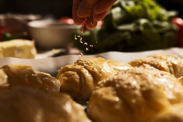 Casserole dish full of rolls almost ready for baking