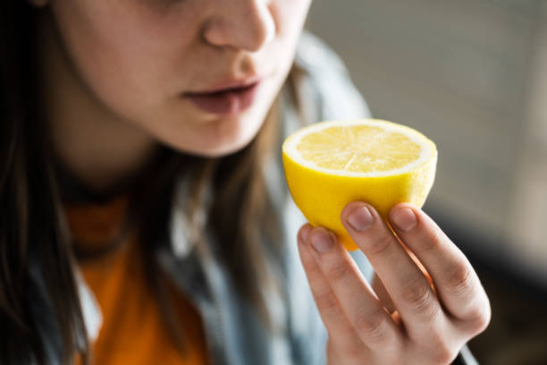 istock Woman Nose Sniffing Lemon Smell 1299487628