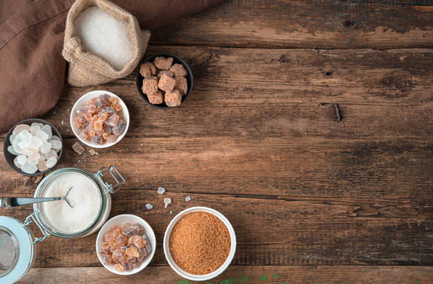 istock Sugar in a large assortment on a wooden background. Top view with copy space 1299489961