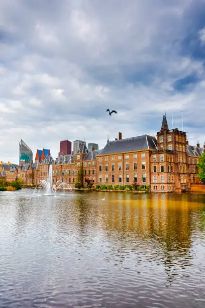 Binnenhof Palace of Parliament inThe Hague in The Netherlands At Daytime. Against Modern Skyscrapers on Background. Vertical Image Orientation