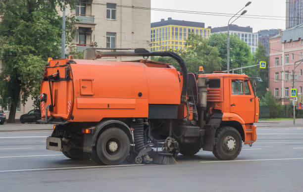 istock road cleaning vehicle moving along street 1299493506