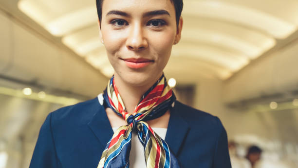istock Cabin crew or air hostess working in airplane 1299494985
