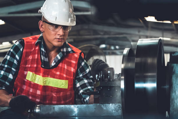 istock Smart factory worker or engineer do machine job in a manufacturing workshop 1299495825
