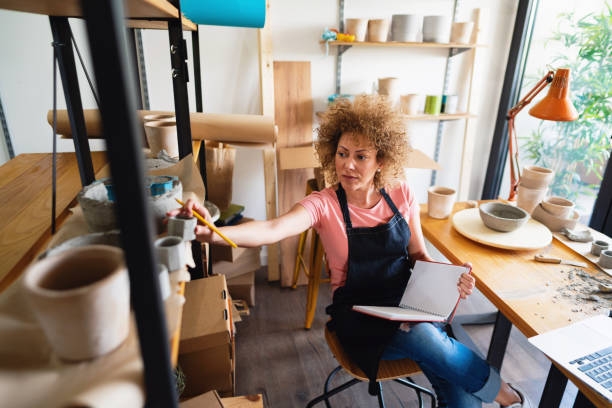 istock Craftswoman working with concrete products in her pottery studio 1299496154