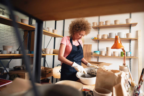 istock Caucasian ethnicity woman at her workshop mixing concrete 1299496160