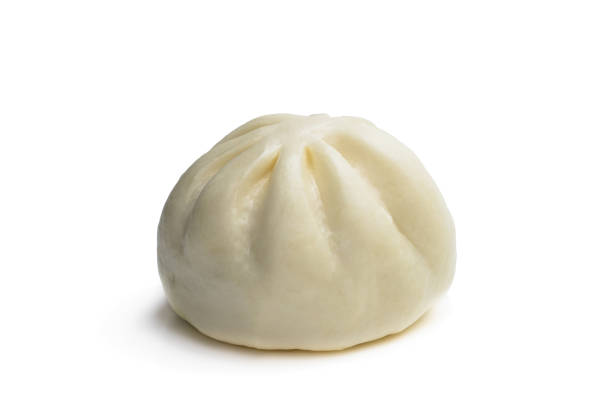 istock Single steamed bao bun isolated on white background 1299496489