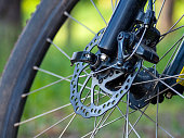 high-speed bicycle disc brake system, perforated disc and caliper, mtb, close-up, mountain bike brake