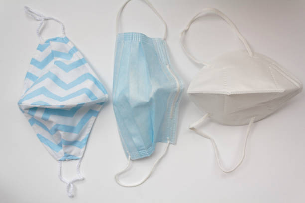 istock Cloth mask, surgical mask and n95 mask. Top view 1299510915