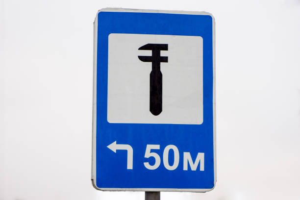istock road sign service station to the left 1299512581