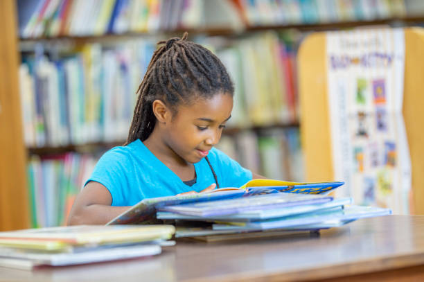 istock I love reading the books at the library 1299516276