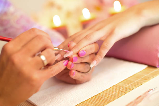 istock Manicure process in the beauty salon. 1299521041