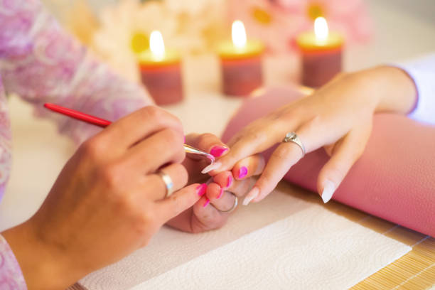 istock Manicure process in the beauty salon. 1299521068