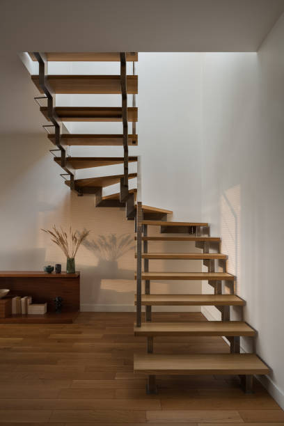 istock Wooden stairs in interior with nice sunlight 1299523561