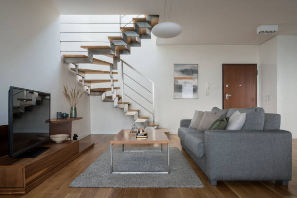 istock Simple living room with modern stairs 1299523575