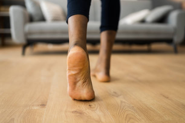 istock African Barefoot Woman Walking On Heated Floor 1299523620