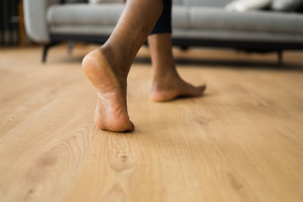 istock African Barefoot Woman Walking On Heated Floor 1299523623