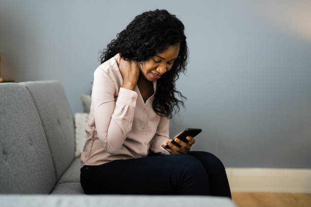 istock Woman Sitting With Phone Haveing Back Pain 1299523687