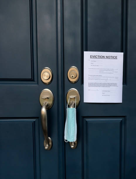 istock Home front door with eviction notice and facemask for renter in default during coronavirus pandemic 1299524475