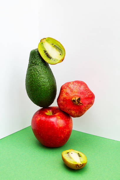 istock A stack of fruit, apple, avocado, pomegranate and kiwi. 1299525839