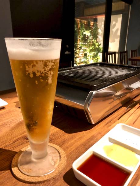 istock A grass of beer and bbq plate. 1299527965