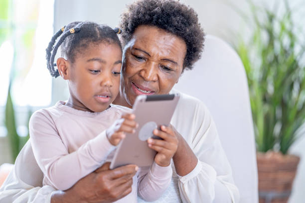 istock Let's watch a video together grandma 1299534387