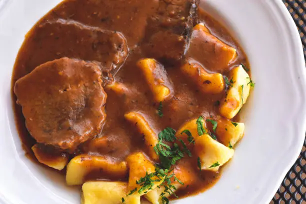 Photo of Croatian traditional cuisine, Pasticada With Gnocchi - Dalmatian Pot Roast or beef/ Croatian dish - Pasticada with gnocchi, beef stew