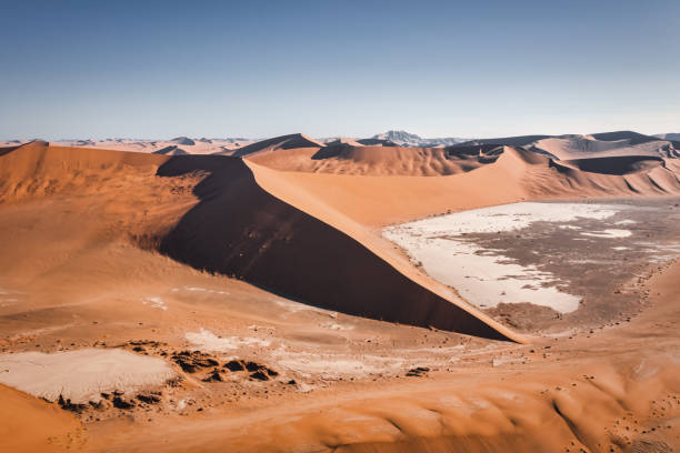 Sossusvlei Namib Desert Sand Dunes Aerial View Sea of Sand Namibia Namib Desert Sand Dunes. Sossusvlei Aerial Drone View over the huge and tall Desert Sand Dunes in the Namib-Naukluft National Park. Sesriem, Namib-Naukluft National Park, Namibia, South West Africa. namib sand sea stock pictures, royalty-free photos & images