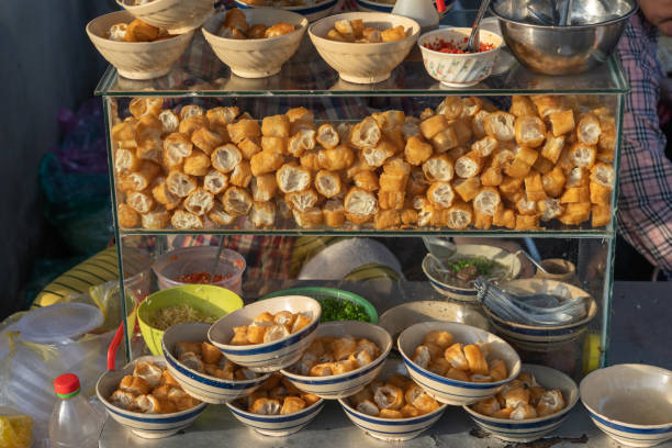 istock Delicious deep-fried bread sticks- youtiao at breakfast vendor 1299538618