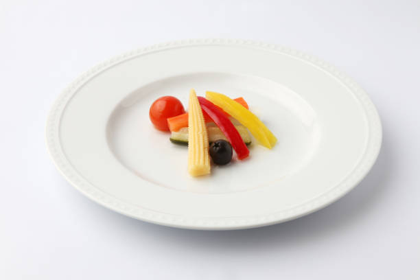 pickles pickled vegetables salad on plate isolated on white background