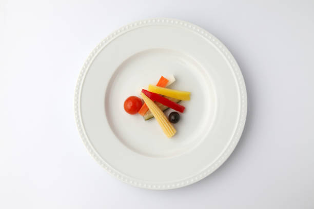 pickles pickled vegetables salad on plate isolated on white background