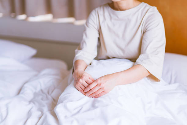 istock middle aged woman get up early on the bed 1299545865