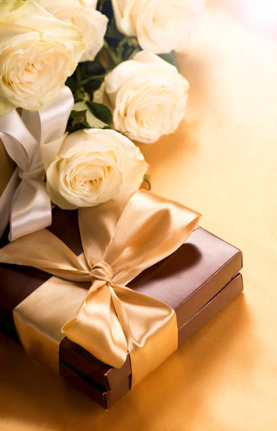 istock brown box with candies and golden tape 1299547833