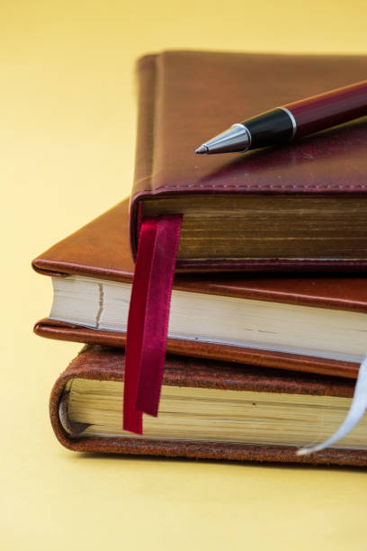 istock ballpoint pen lies on a notebook close-up 1299552644