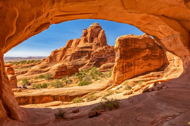 Looking through Tower Arch in the Klondike Blufs area of Arches National Park, Utah.