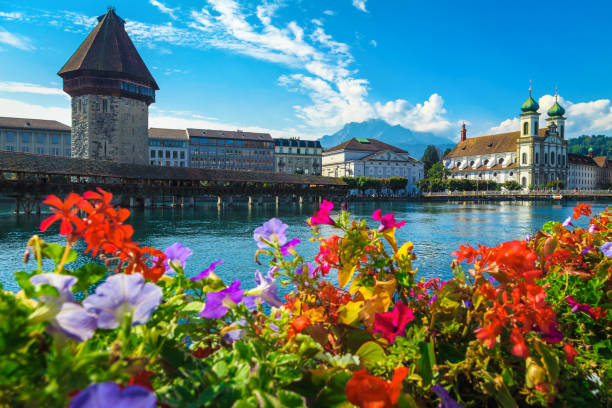 istock Flowery waterfront and Chapel bridge on the Reuss river, Lucerne 1299554525