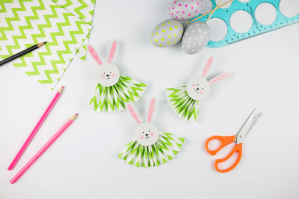 istock Easter bunny out of paper. DIY step by step. Crafts concept for kids. 1299554906