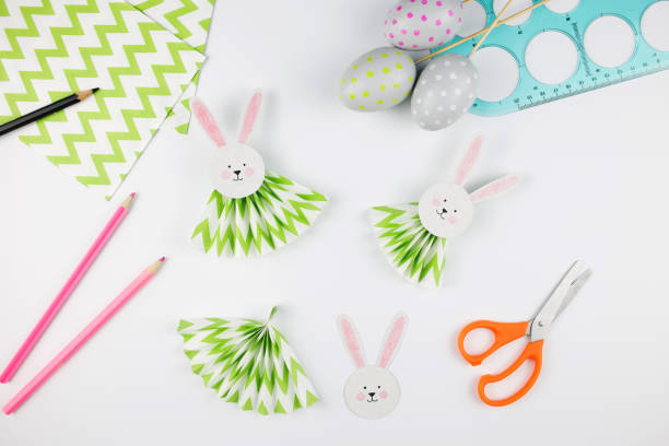 istock Easter bunny out of paper. DIY step by step. Crafts concept for kids. 1299554907