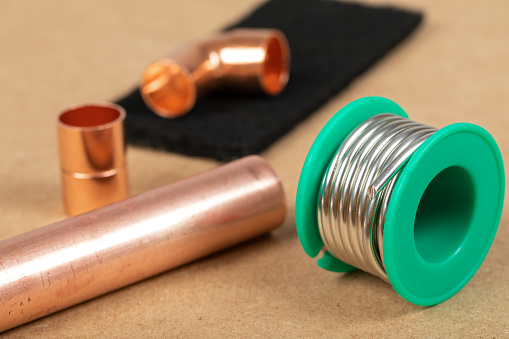 Objects of home heating system: copper plumbing parts, gas soldering