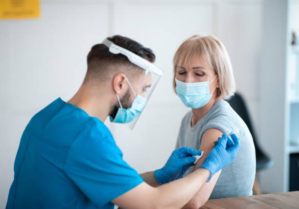 istock Coronavirus prevention and treatment concept. Senior female patient getting vaccinated against covid-19 at clinic 1299556887