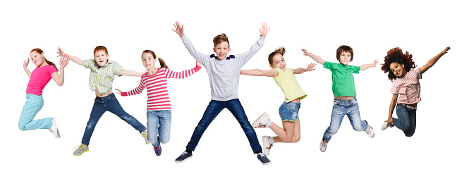 Joyful Multiracial Kids Jumping In Mid-Air Posing Together Over White Studio Background. Carefree Children Group In Casual Clothes Jump In A Row. Childhood, Diversity And Fashion. Collage, Panorama
