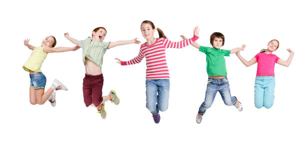 istock Joyful Children Jumping In Mid-Air Posing Over White Background 1299561530